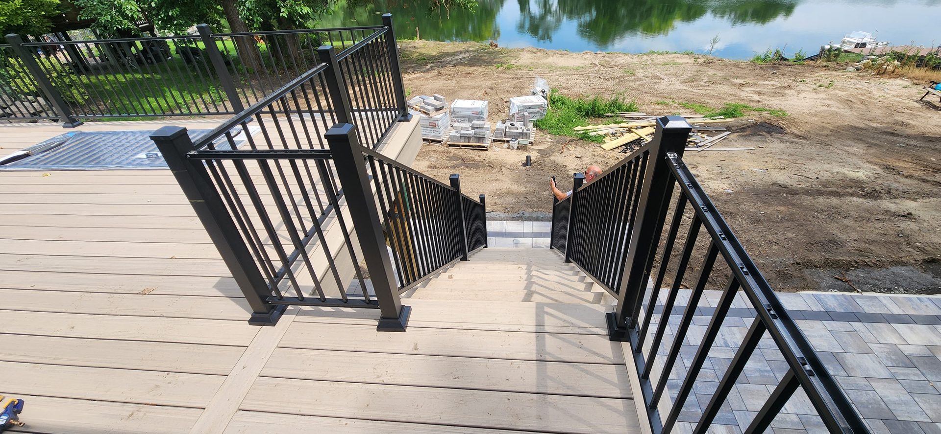 Composite deck stair and railing detail near water