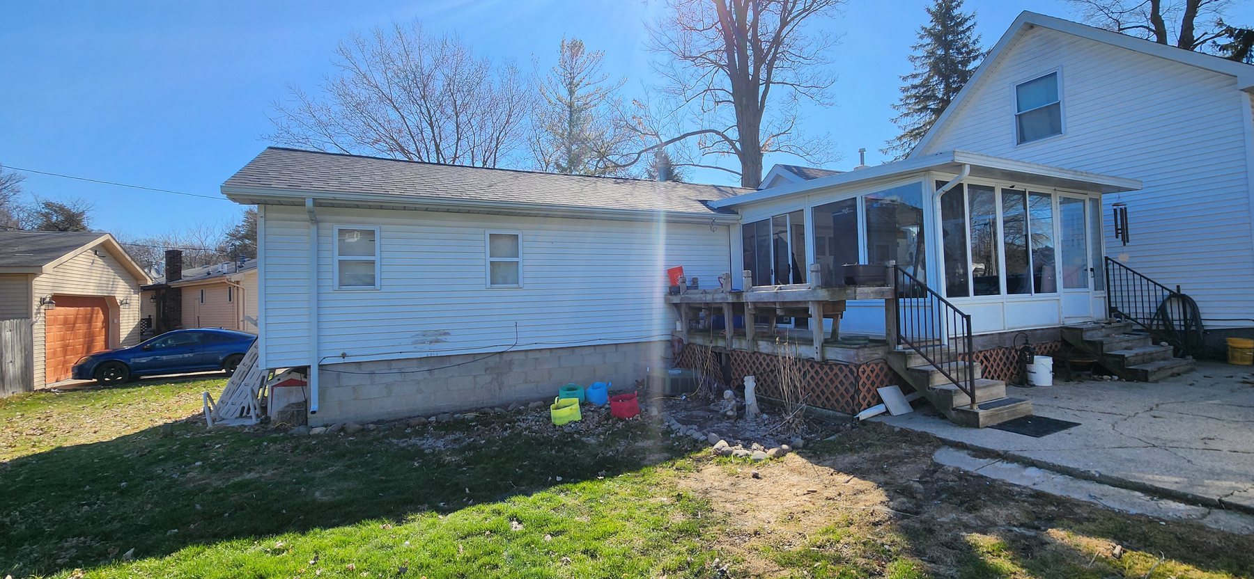 Original Irwin sunroom and rear of home before reconstruction