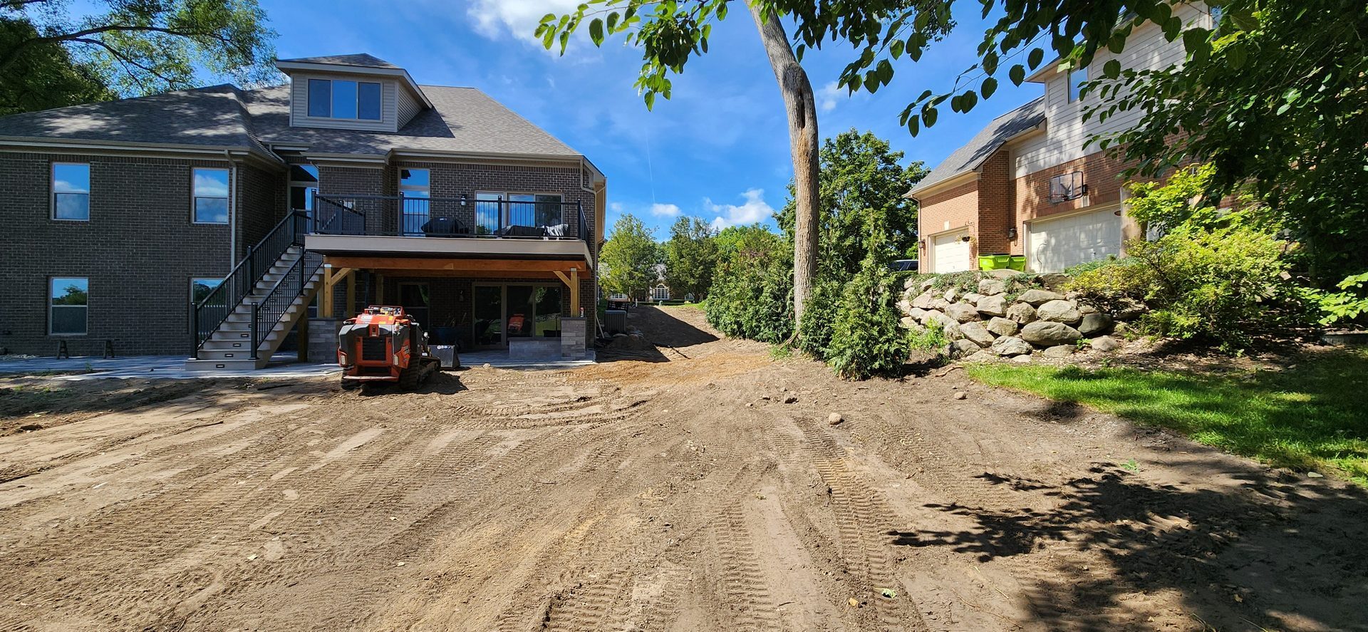 Outdoor construction project site near a lake