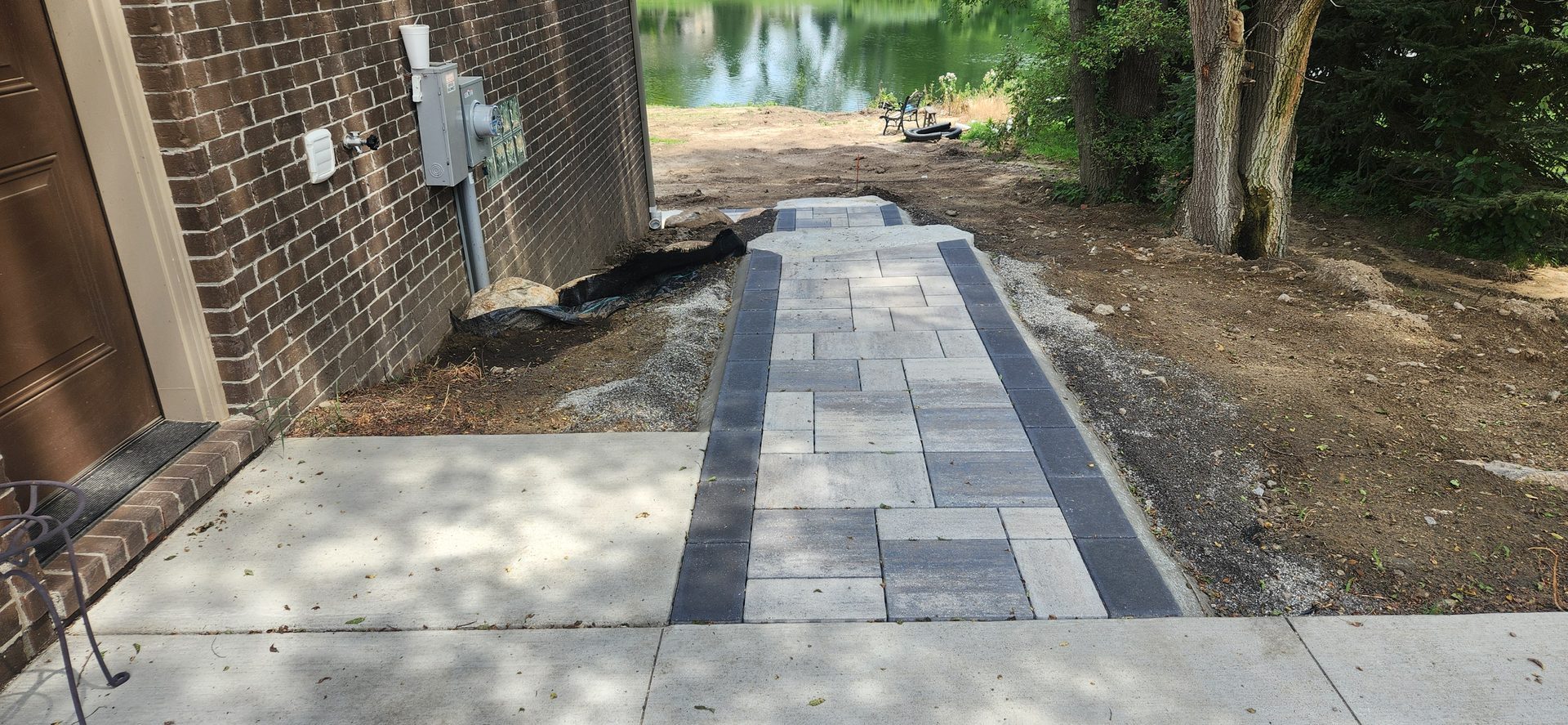 Paver walkway beside a home